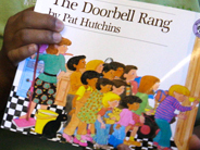 Close-up of the book cover of The Doorbell Rang.