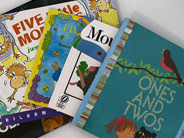 An array of subitizing books lie on the table.