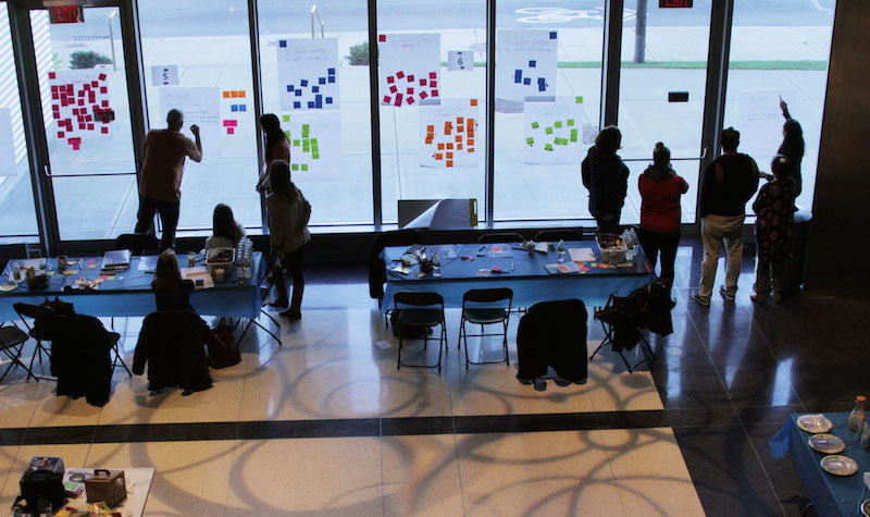 Parents and community members brainstorm challenges they face.