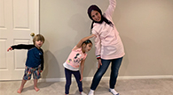 Parent and children stretching.