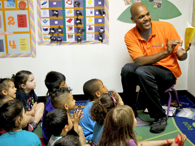 Teacher reading The Carrot Seed book to class.
