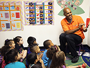 Teacher reads book to students.