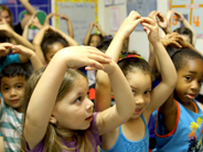 Children sing and act out the steps for planting and caring for a seed.