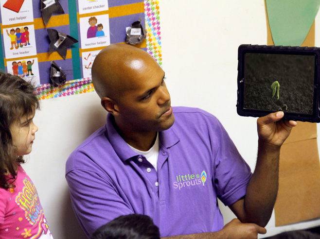 Teacher shows students 'It's Alive!' video on iPad.